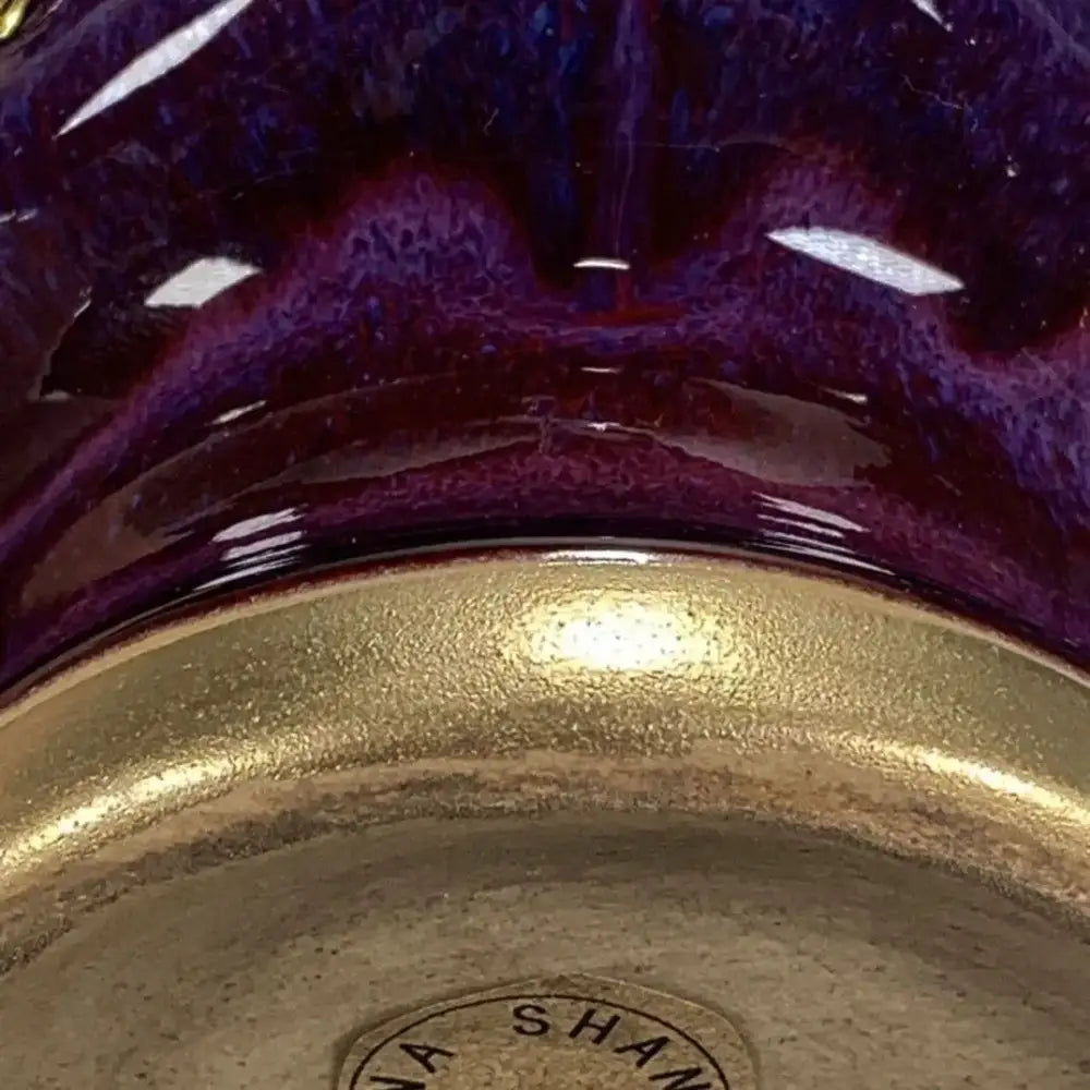 A glossy purple jun porcelain gilded gemstone vase with gold rim and speckled finish for living room decor