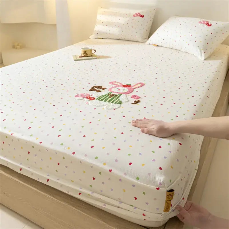 White fitted sheet with colorful heart patterns and central embroidered bunny decorbites cartoon embroidered bedding