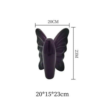 A glossy dark purple butterfly ceramic vase with detailed wing patterns for living room decor by decorbites dark butterfly