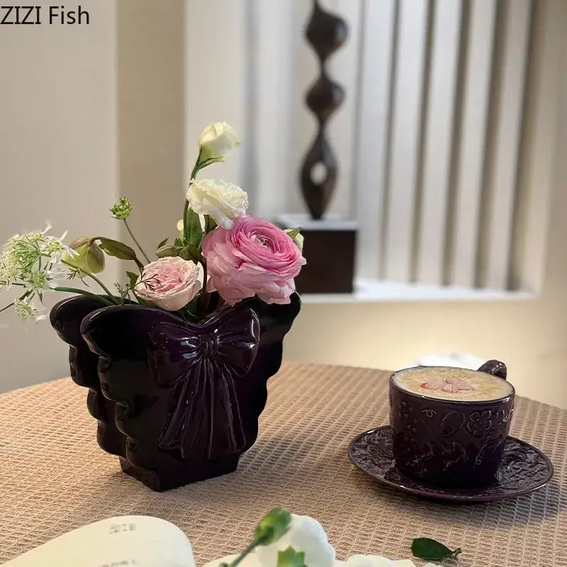 Dark purple glossy ceramic bow vase with floral arrangements decorbites dark butterfly decor for living room