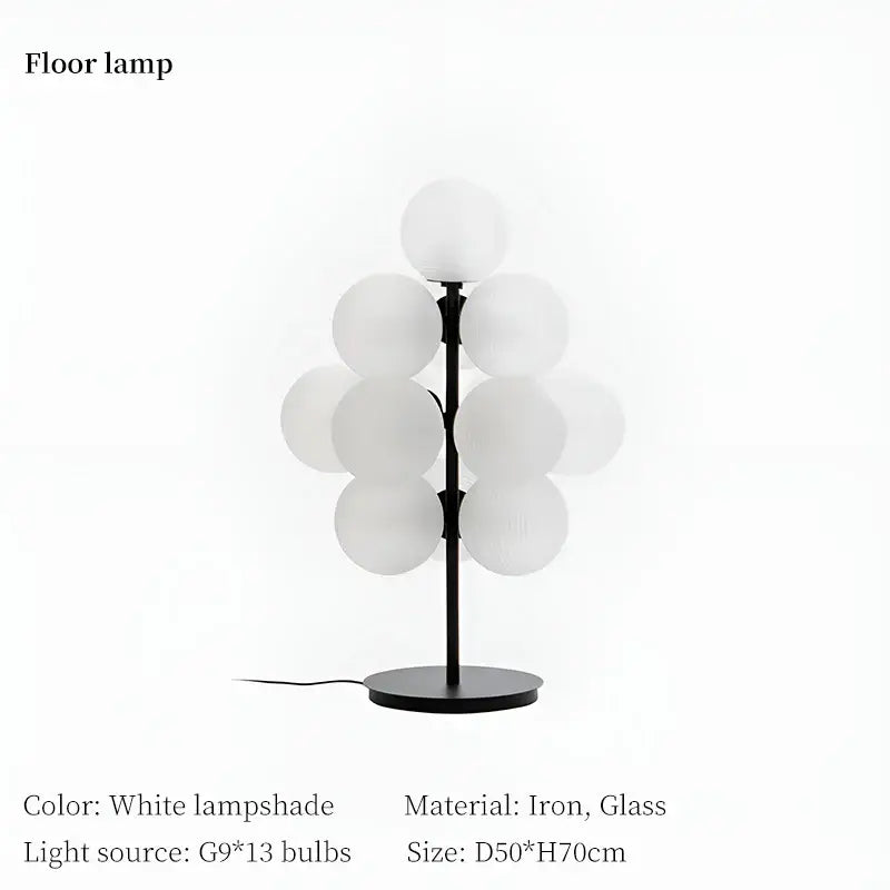 Modern white glass globe floor lamp with sleek black iron base complements decorbites grape chandelier lighting