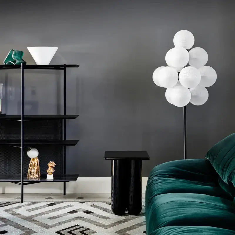 A modern floor lamp with white spherical paper lanterns in a tree-like design for decorbites grape chandelier lighting