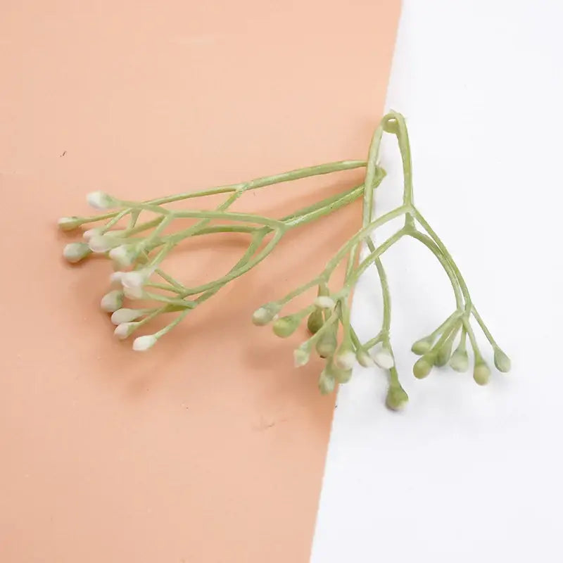 A delicate cluster of artificial plants from decorbites 10pcs plastic grass with green stems and white buds for decor