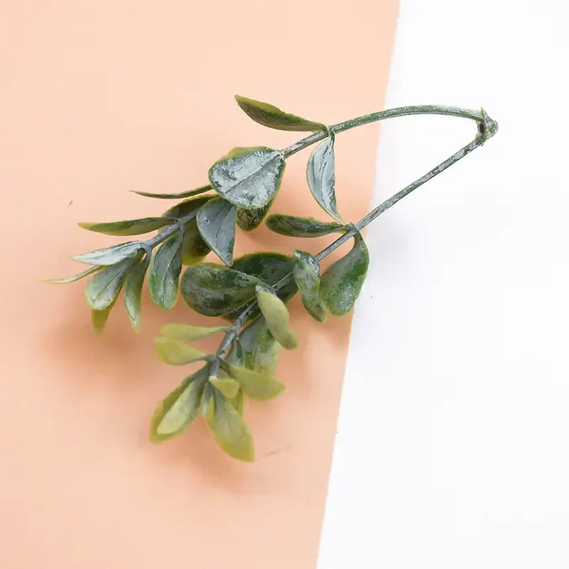 A delicate artificial plants branch with glossy variegated green leaves in decorbites 10pcs plastic grass set for decor