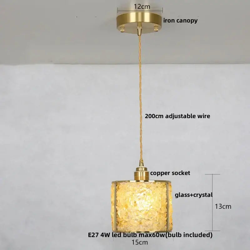 A warm golden-hued decorbites crystal glass led pendant light with textured shade for living room decor