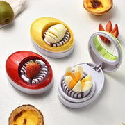Purple rotating blade egg cutter slicer with colorful oval shape and segmented chamber for evenly slicing eggs or fruits