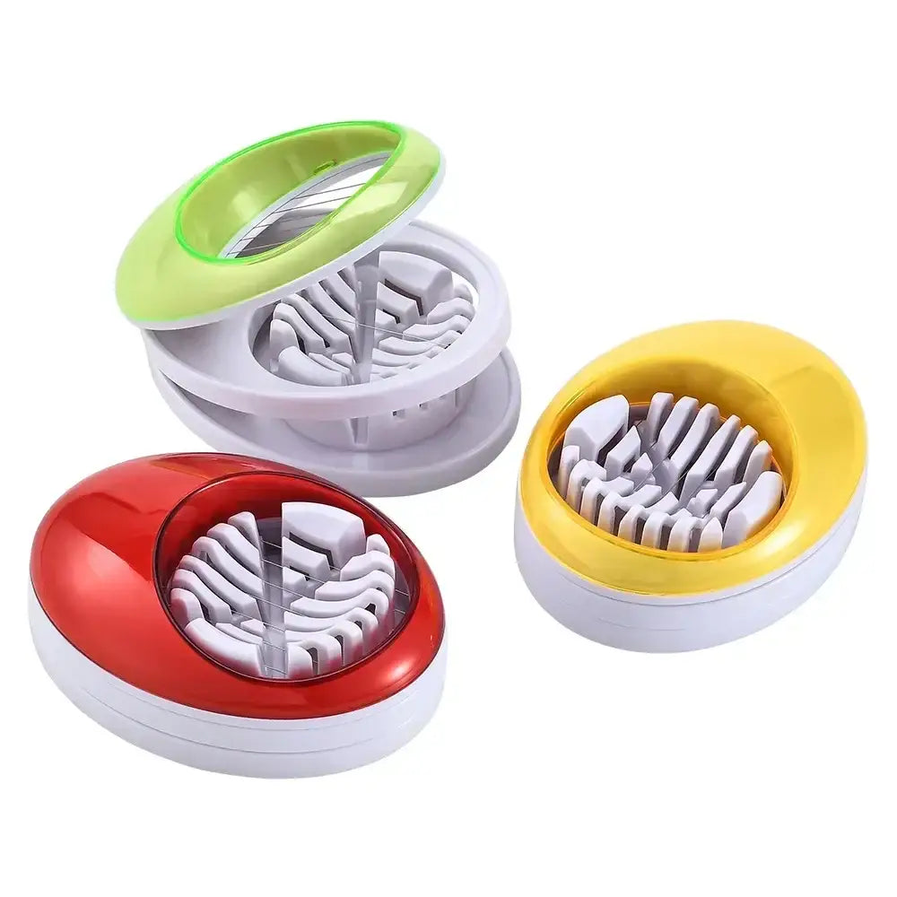 Three colorful egg cutter slicers with glossy red yellow and green plastic exteriors for kitchen use