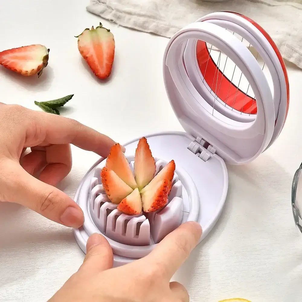 Purple rotating blade egg cutter slicer with white and red circular design and multiple blades for even slicing