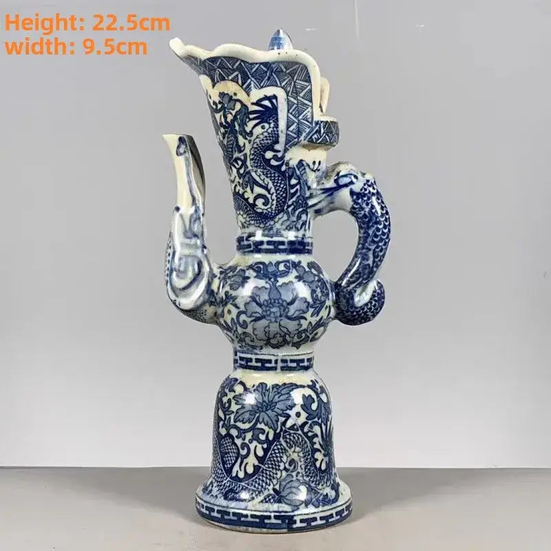 Blue and white porcelain decorative pitcher with intricate white dragon pattern and floral motifs for living room decor