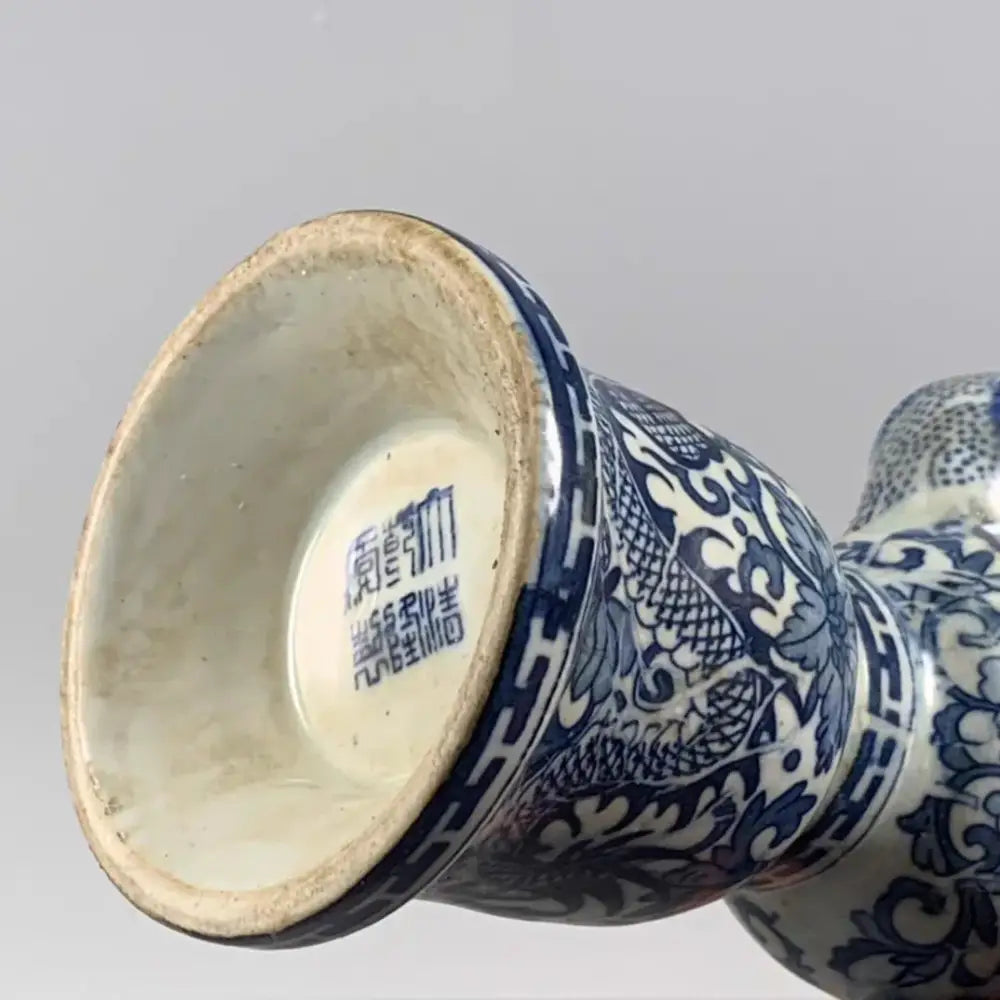 Qing blue and white porcelain vase with intricate white dragon pattern and classic Chinese decorative motifs for living room decor