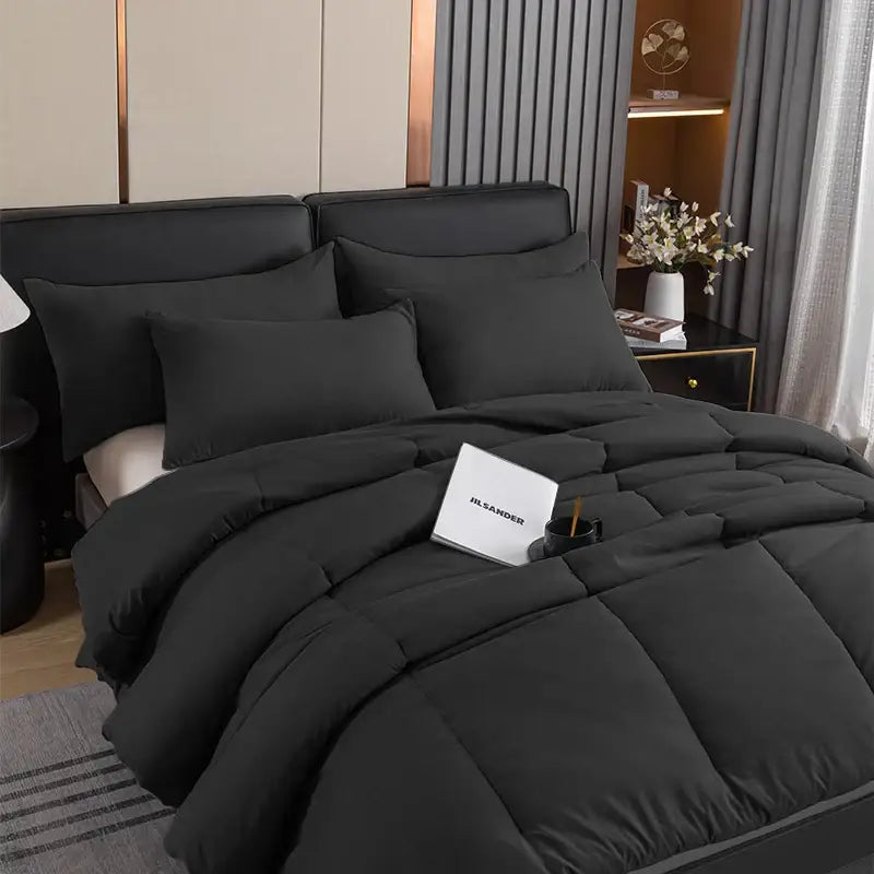 Black quilted comforter with plush soft texture and subtle sheen in decorbites cozy queen king pillowcase set