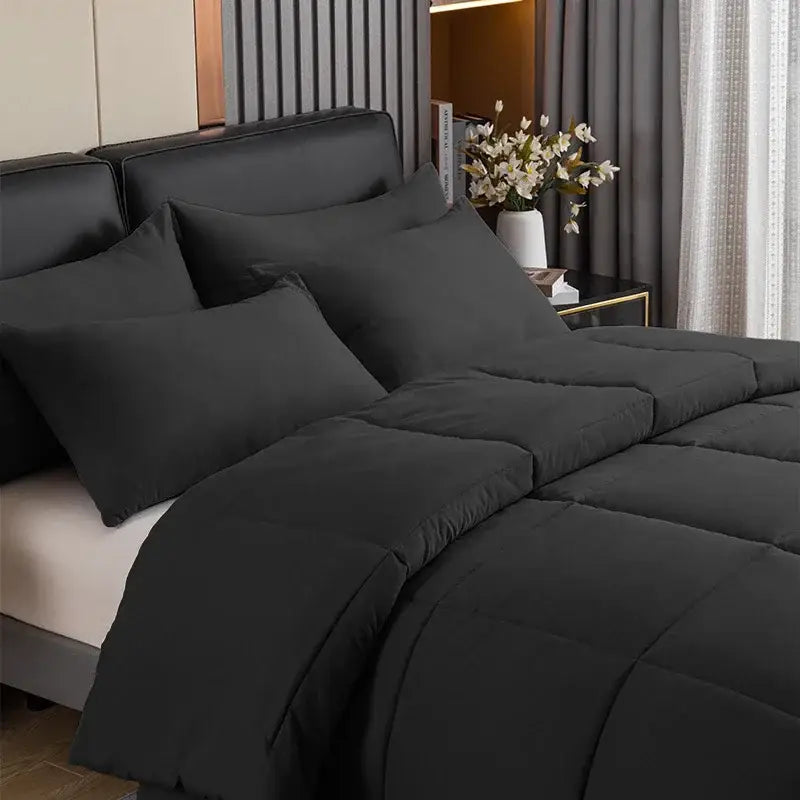 Black quilted comforter with plush soft texture and subtle stitching in decorbites cozy queen king pillowcase set