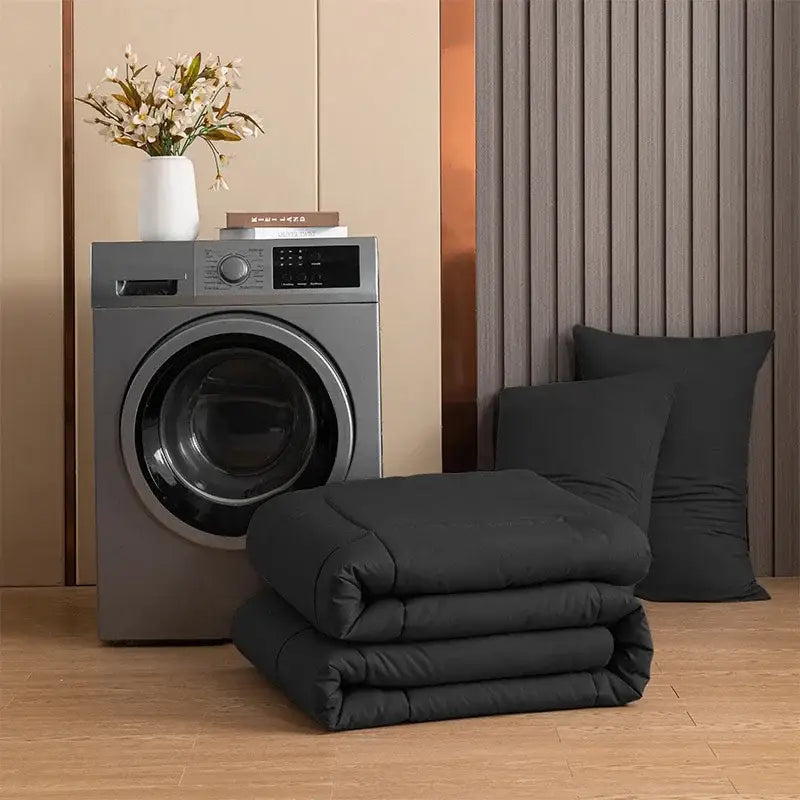 Stacked black quilt with plush texture and subtle stitching from decorbites cozy queen king pillowcase set