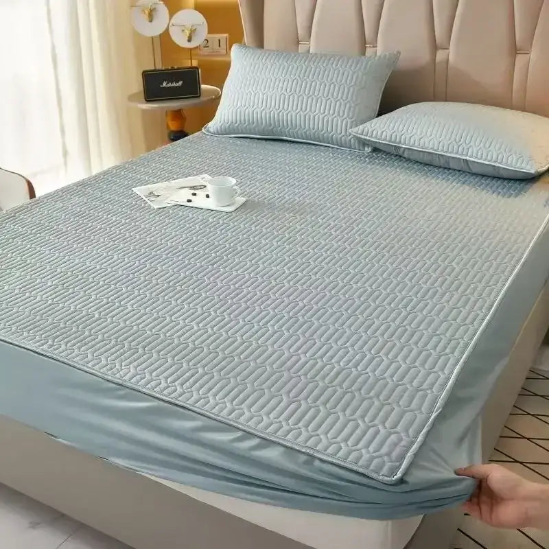 Light blue quilted latex fitted sheet set with subtle geometric pattern and elastic edge for cooling mattress pad