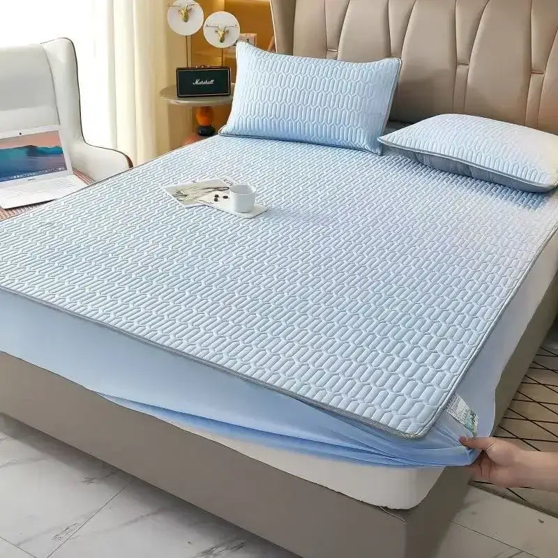 Light blue quilted latex fitted sheet with a subtle geometric pattern and elastic edge for a snug fit mattress pad sheet set