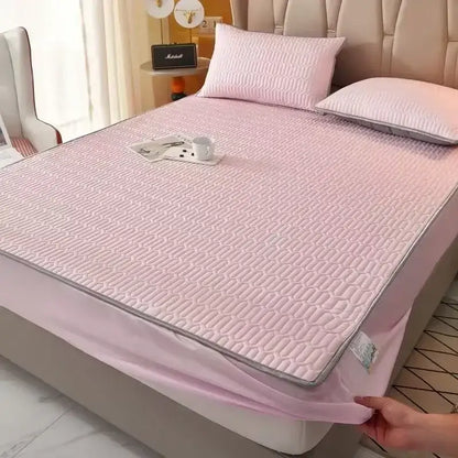 Pink quilted fitted sheet set with subtle gray border made from cooling latex material for bedroom mattress pad