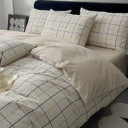 Quilted cream and black geometric printed bed set with matching pillowcases and soft grid pattern texture