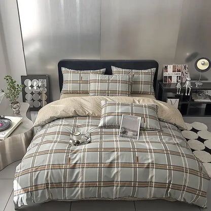 Quilted cream and black geometric printed bed set with plaid-patterned bedding in soft gray beige and brown tones