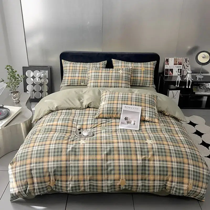 Quilted cream and black geometric printed bed set with plaid comforter in olive green beige and cream tones featuring stars