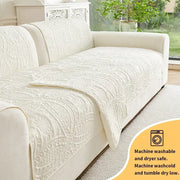Cream-colored quilted sofa cover with intricate floral embroidery for living room cushions