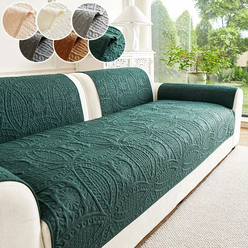 Deep green quilted sofa cover with intricate floral embroidery for living room cushions
