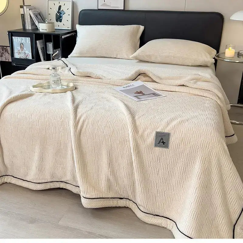 Cream-colored textured knit plush blanket with black piping and gray pocket soft cozy cotton velvet decorbites cozy cotton