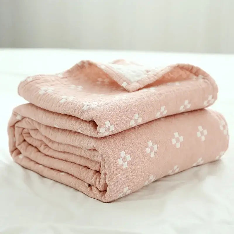 Soft pink quilted decorbites cotton summer blanket with subtle white crosshatch pattern for bedroom decor