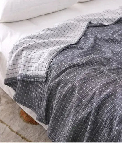 Quilted gray and blue decorbites cotton summer blanket with gray and white checkered cotton muslin texture for bedroom use