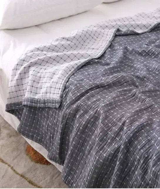 Quilted gray and blue decorbites cotton summer blanket with gray and white checkered cotton muslin texture for bedroom use