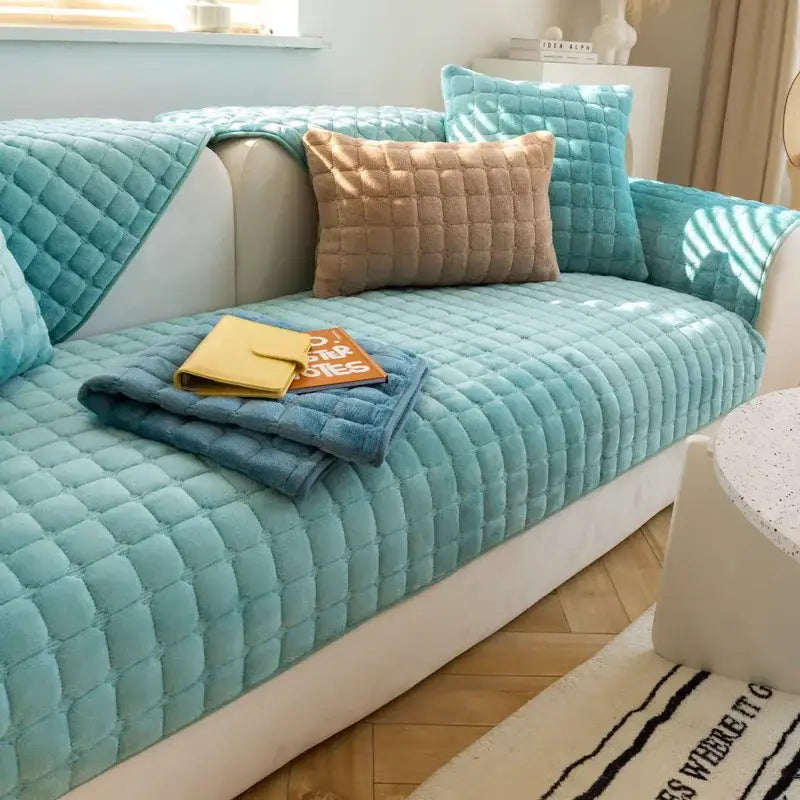 Turquoise quilted velvet sofa cover with diamond-stitched pattern for gray and tan faux fur living room set