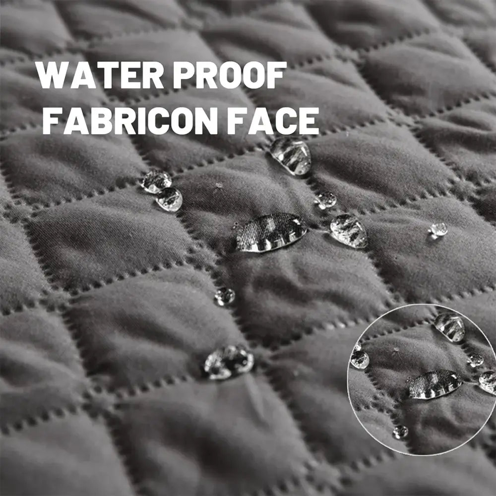 Dark gray quilted waterproof dog bed cover with diamond stitching and water droplets on non slip bed cover surface
