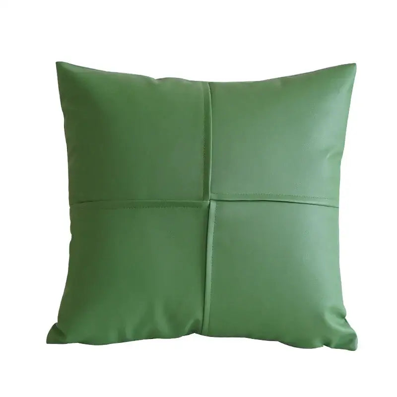 A green quilted faux leather pillow cover with four stitched sections for decorbites ivory leather pillow decor