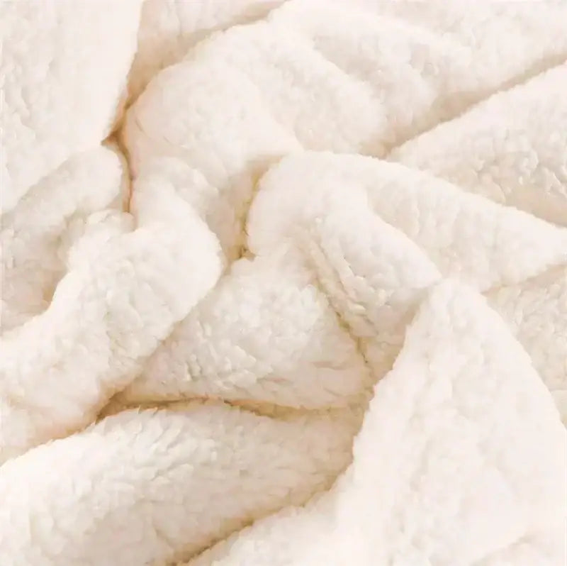 Soft white faux fur coral fleece blanket with plush textured surface for decorbites cozy bedroom bedding use