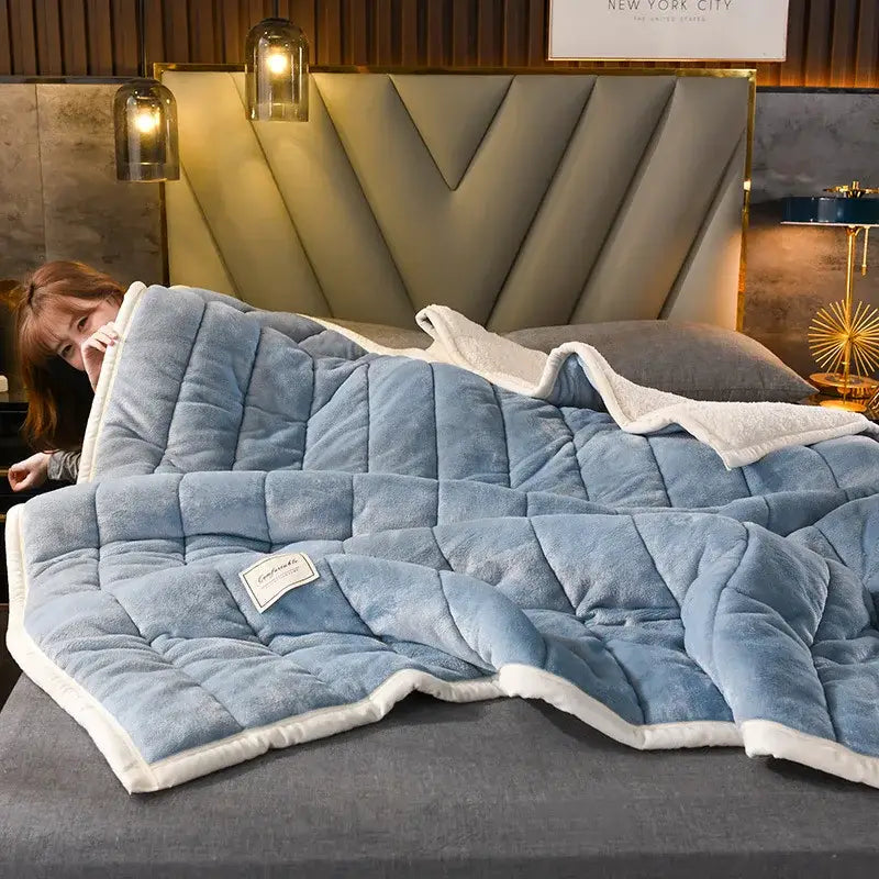 Quilted light blue and white cozy coral fleece bed blanket with plush lining and diamond stitch by decorbites cozy coral