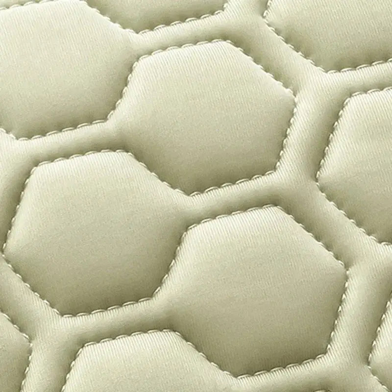 Beige quilted fabric with hexagonal stitching pattern on decorbites cooling mat for bedroom bedding set