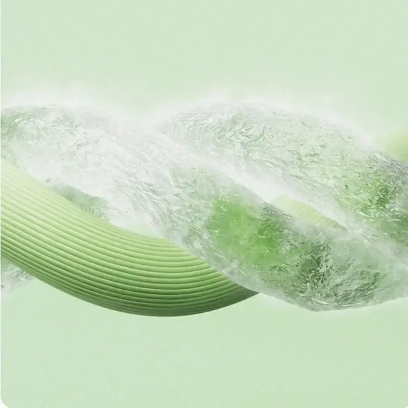 A sleek ribbed green hose with a translucent water-filled section shown alongside a quilted pink bed skirt set with silver trim