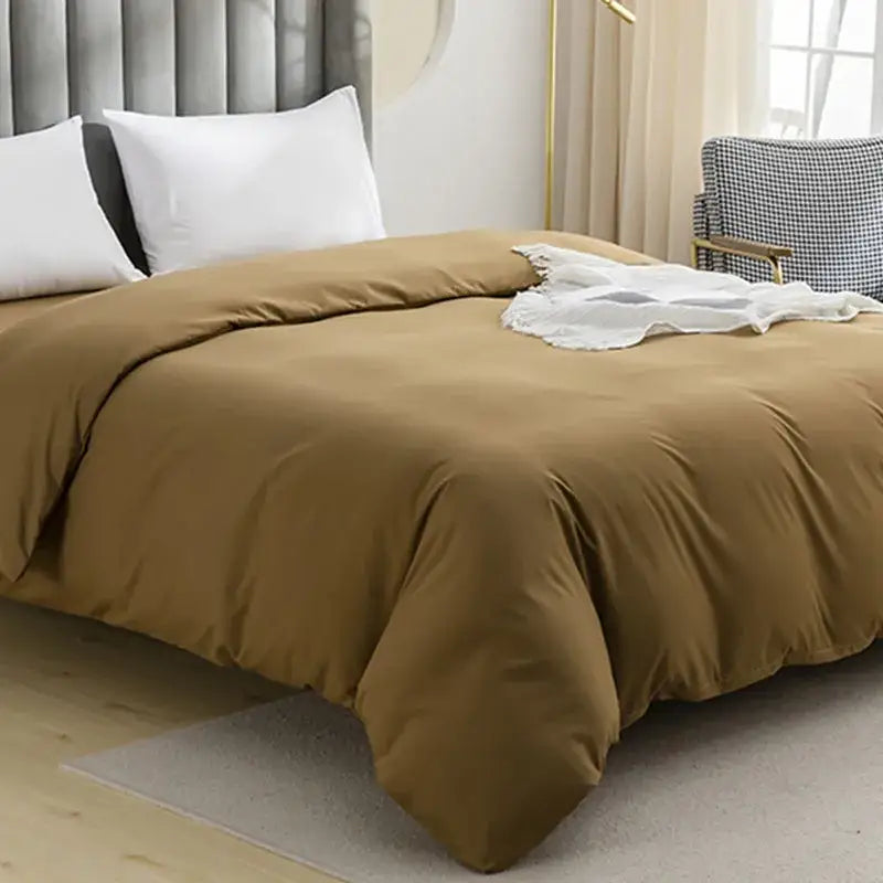 Warm brown quilted duvet cover set with soft smooth texture and subtle sheen for comfortable bedroom bedding