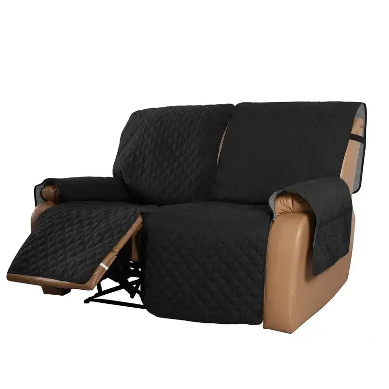 Black quilted fabric sofa protector with diamond stitching designed to fit a recliner for living room use