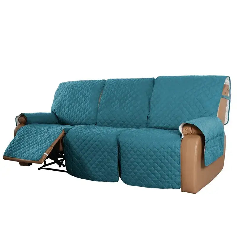 Teal quilted recliner slipcover with diamond-stitched pattern and padded edges for living room use