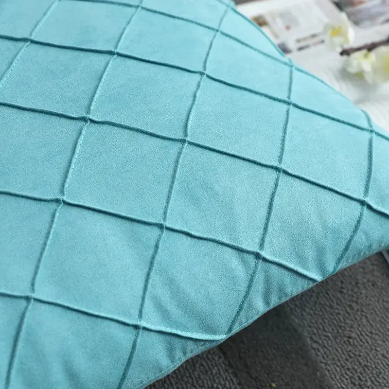 Teal quilted velvet lattice cushion cover with suede texture and diamond embroidered lattice pattern for living room use