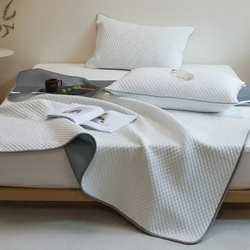 White quilted cooling mat and pillowcase set with gray border textured surface by decorbites ice bean
