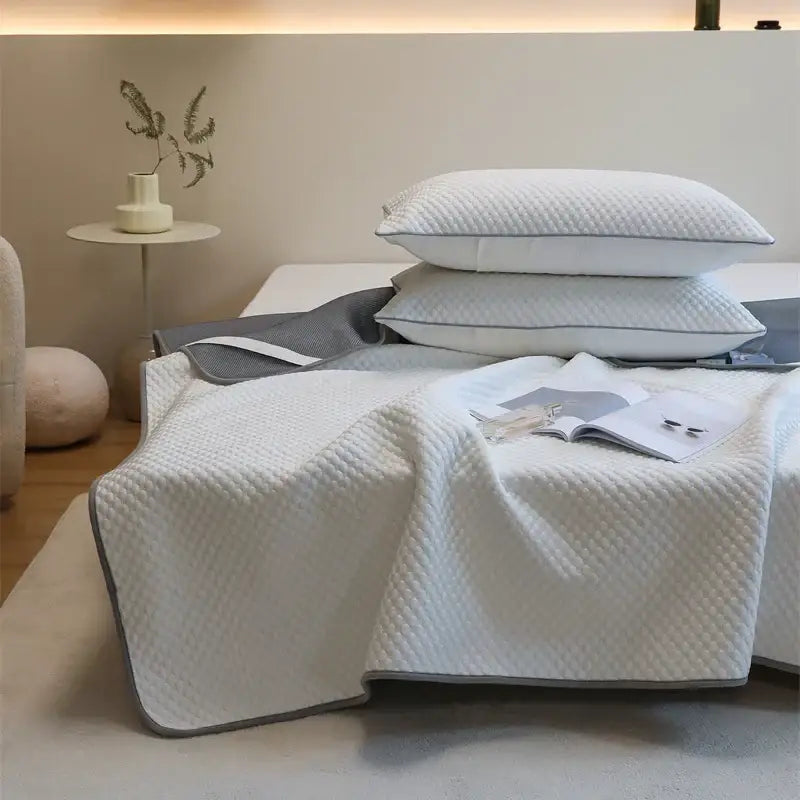White quilted cooling mat and pillowcase set with gray trim for bedroom decorbites ice bean collection
