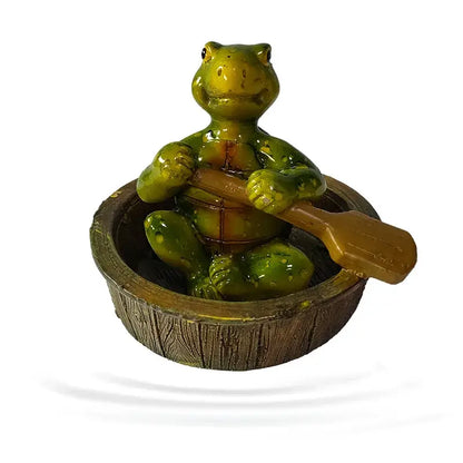 Green ceramic turtle figurine with oar sitting in wooden bowl as decorbites garden water floating animal accessory