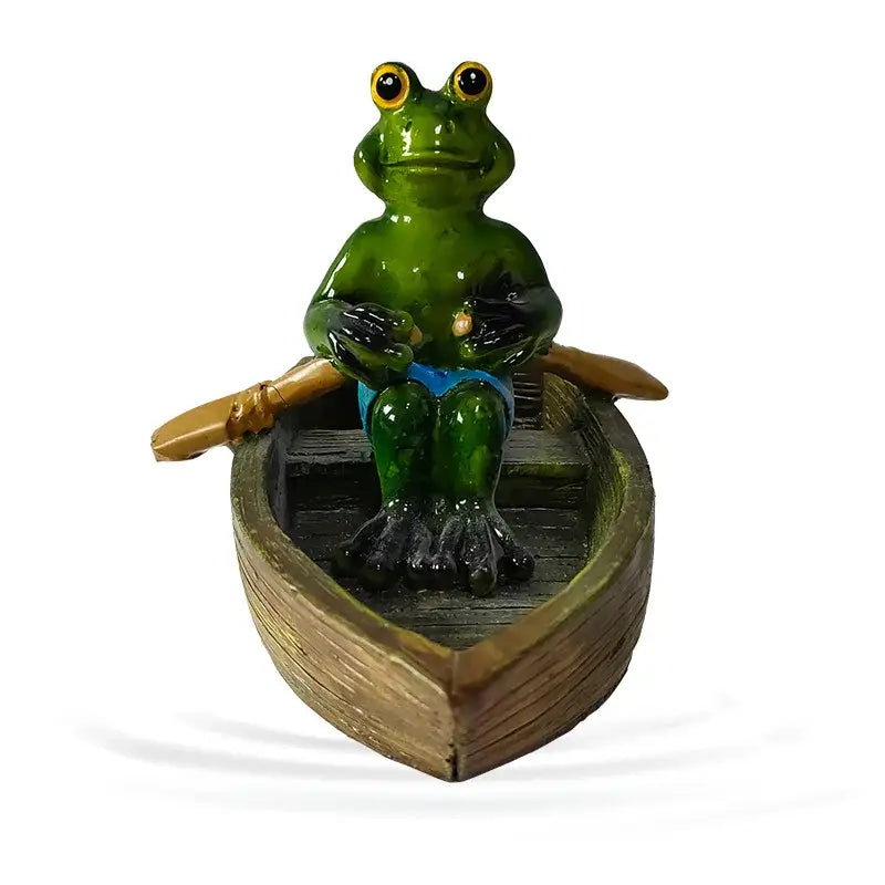 Green frog figurine with yellow eyes and black hands seated in wooden boat holding oars for decorbites garden water floating use