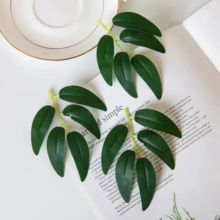 Realistic dark green silk willow leaves with light green stems arranged in clusters for wedding and home decor