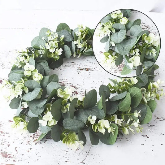A decorbites eucalyptus leaf wreath with artificial green eucalyptus leaves and small white flowers for living room decor