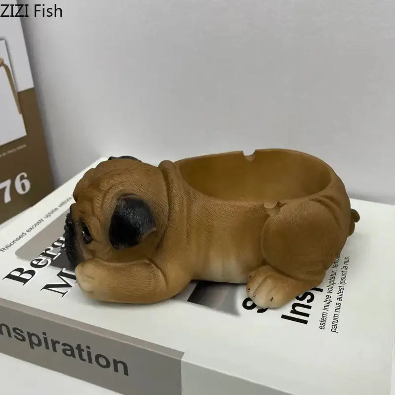 Brown pug-shaped puppies resin ash tray with black ears and glossy finish for office table decor