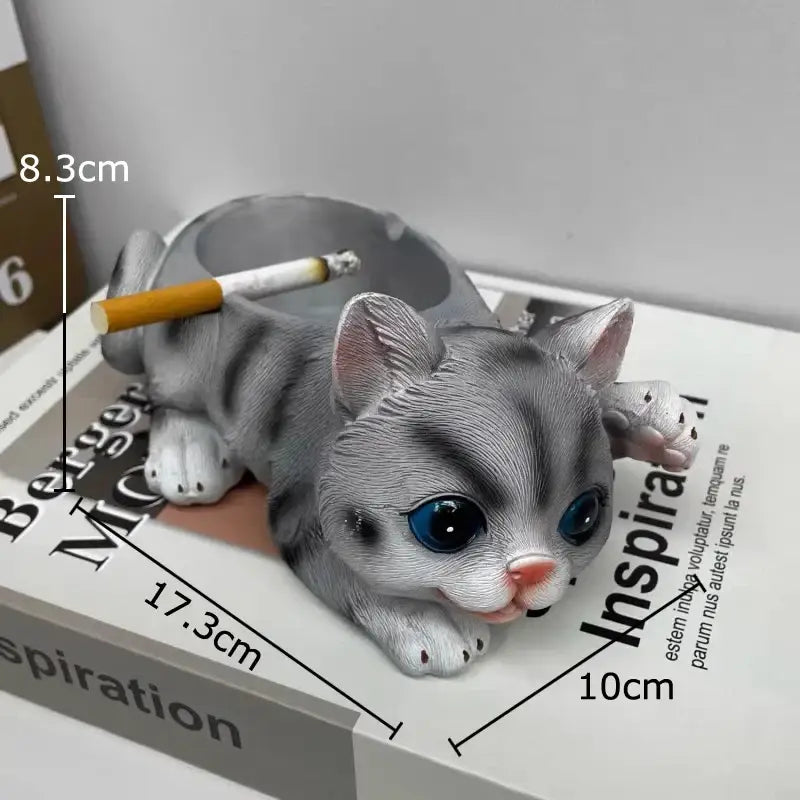 Realistic gray cat resin ash tray shaped like a gray tabby kitten with blue eyes and pink nose for office decor