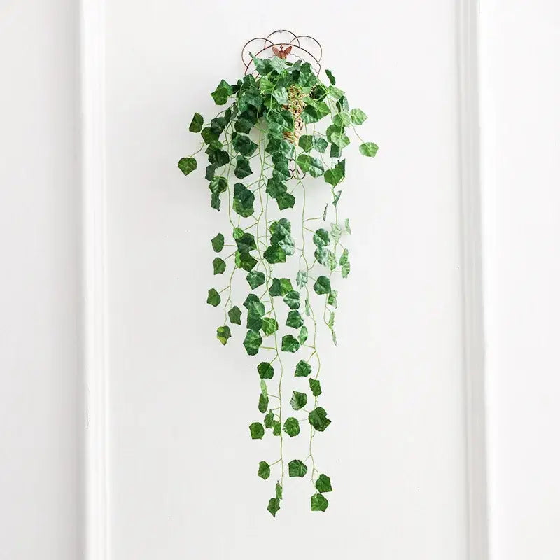 Green artificial ivy plant hanging from decorative metal hook from decorbites ivy bar living room decor