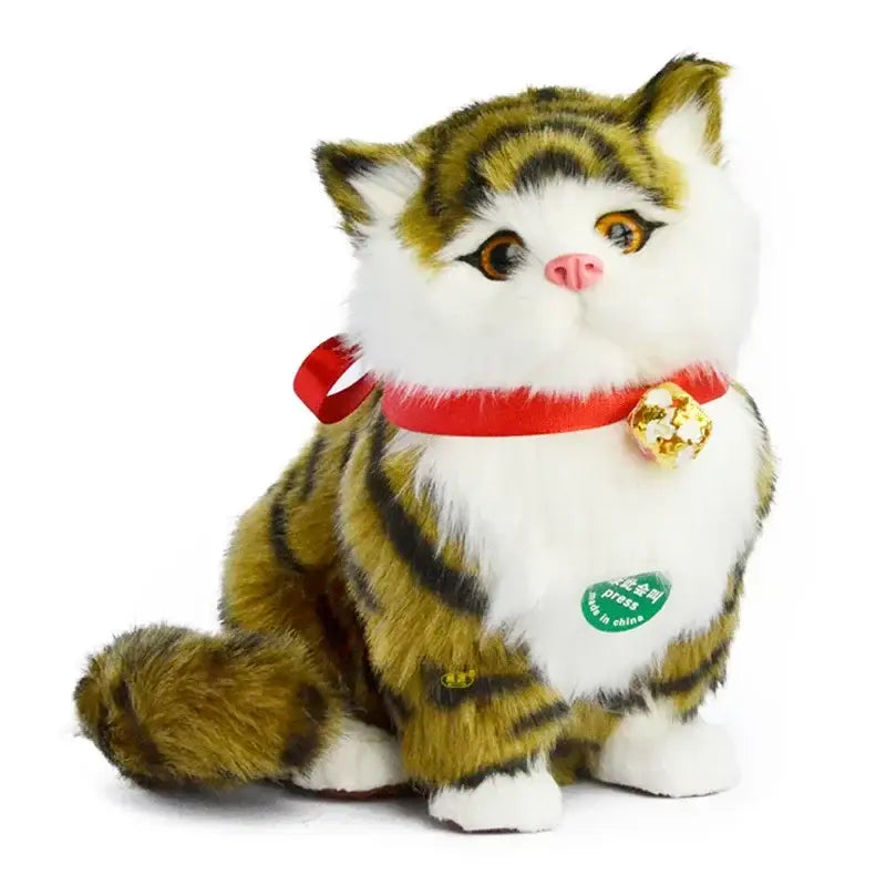 A plush sitting tabby cat dog plush with green and black stripes on white body wearing red collar with gold bell for home decor